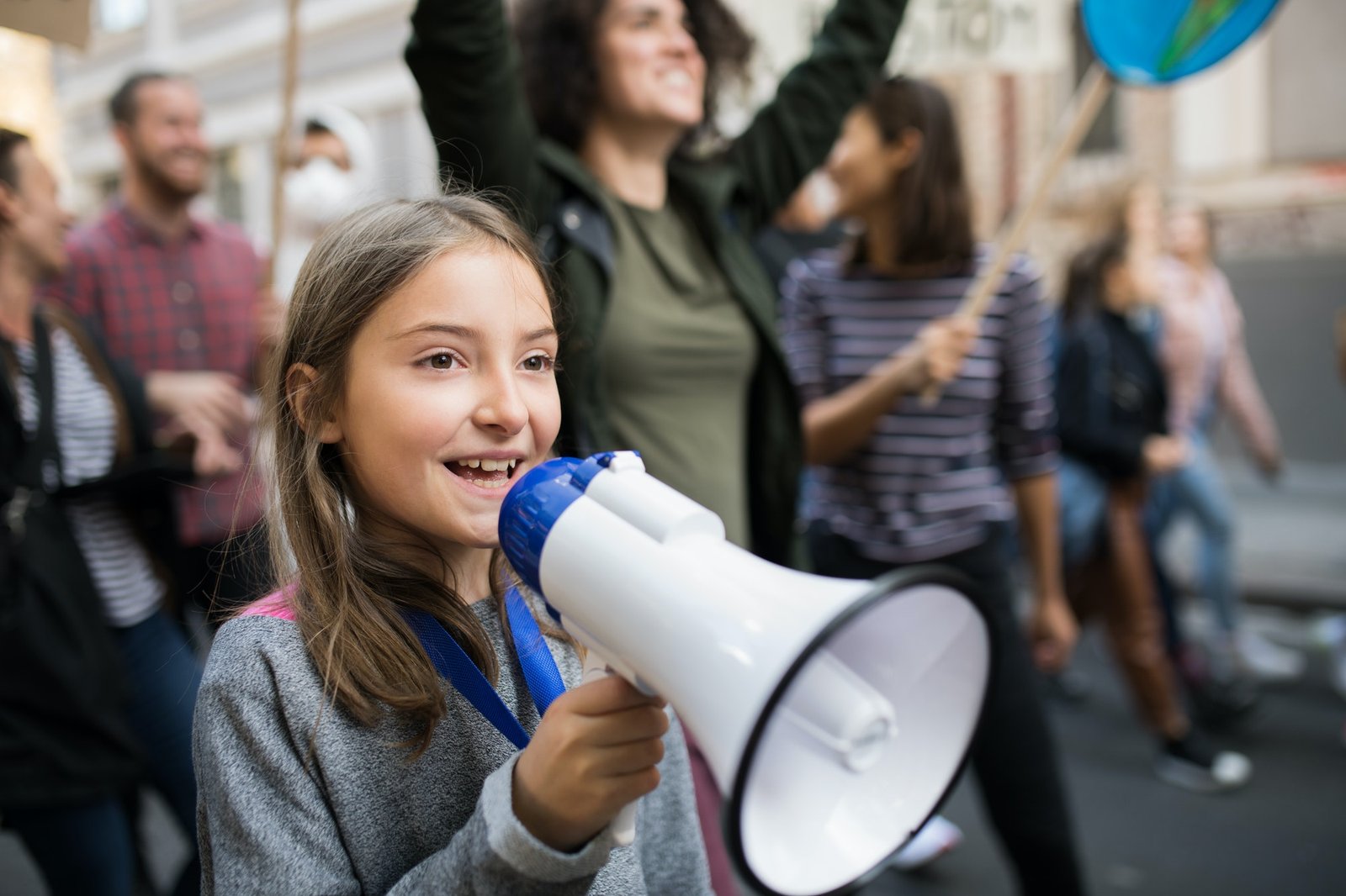 Small child with amplifier on global strike for climate change|